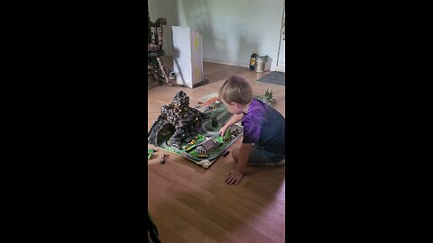 Gray playing with the train set