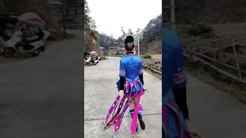 Chinese Minority Girl Dances In Her Native Cultural Clothes