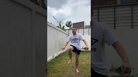 Football in the backyard before the rain comes.