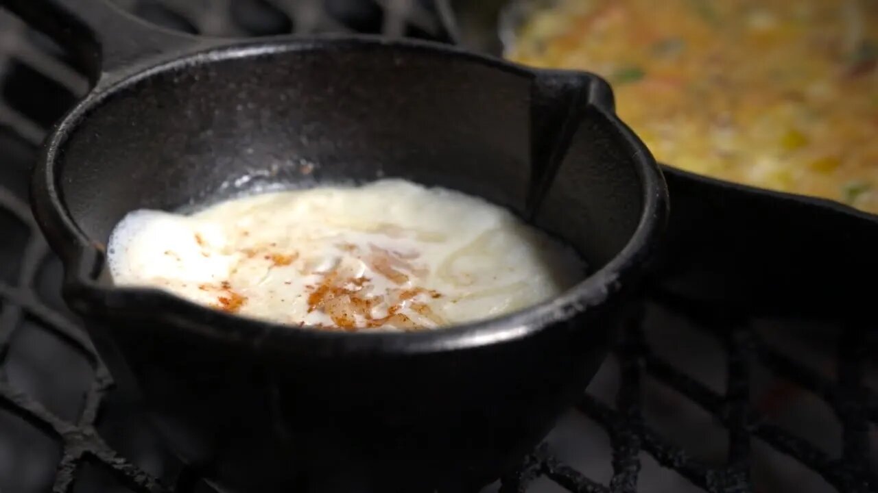 Two Cowboys are Cooking Eggs on the Fire and in a Pot