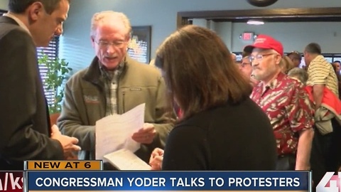 Congressman Yoder talks to protesters