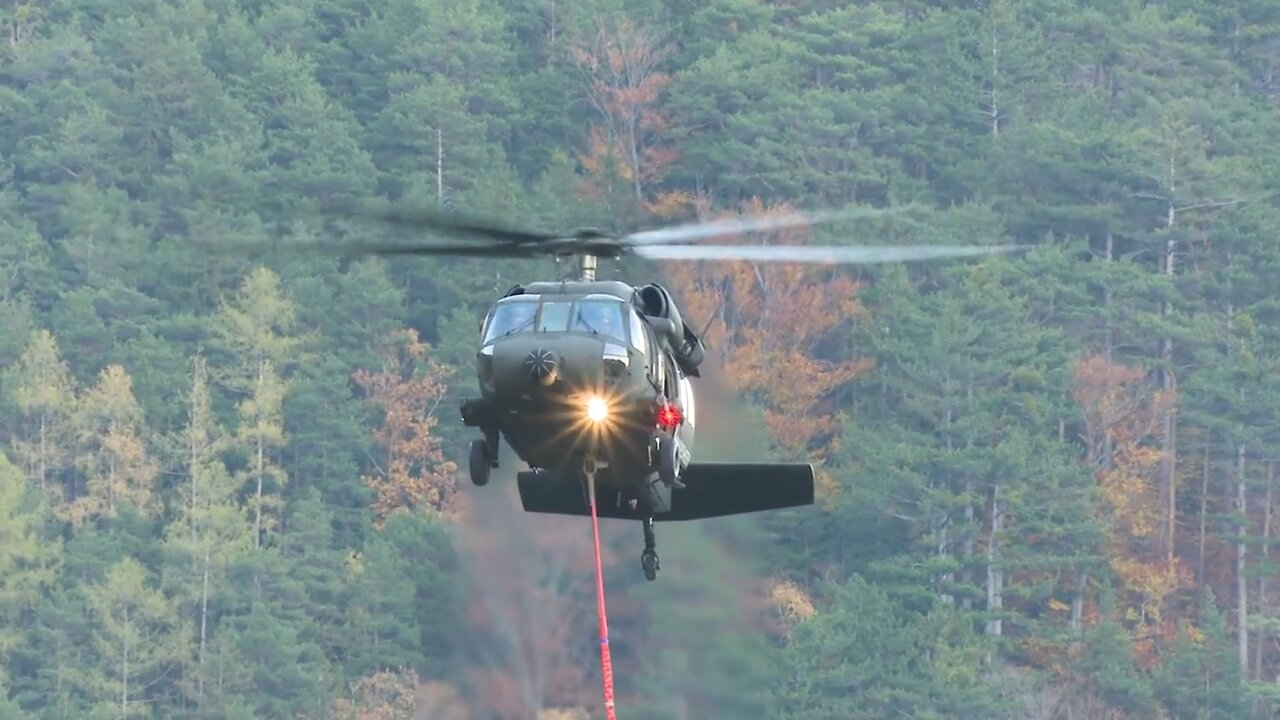 Helicopter filling up with water to out out fire