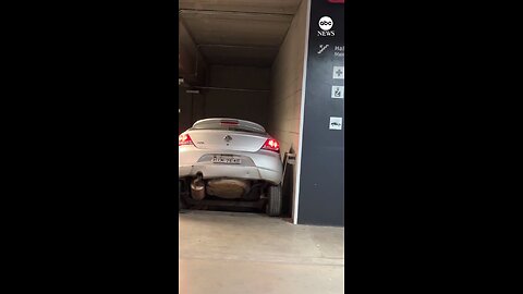 Motorist gets stuck in stairwell in Brazil garage