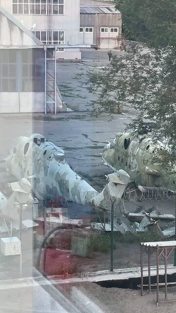 Several disused and abandoned Mil Mi-24 Hind helicopters.