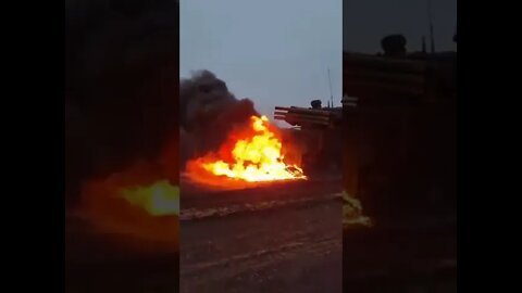 Ukrainian civilians burn a Russian Pantsir anti-aircraft system in the Kherson region