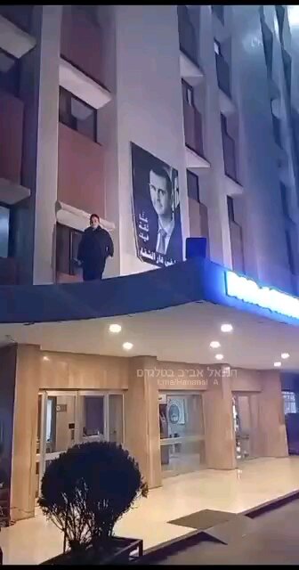 Syria and it Capitol conquered by the rebels. President Asad escaped on airplane. His poster removed