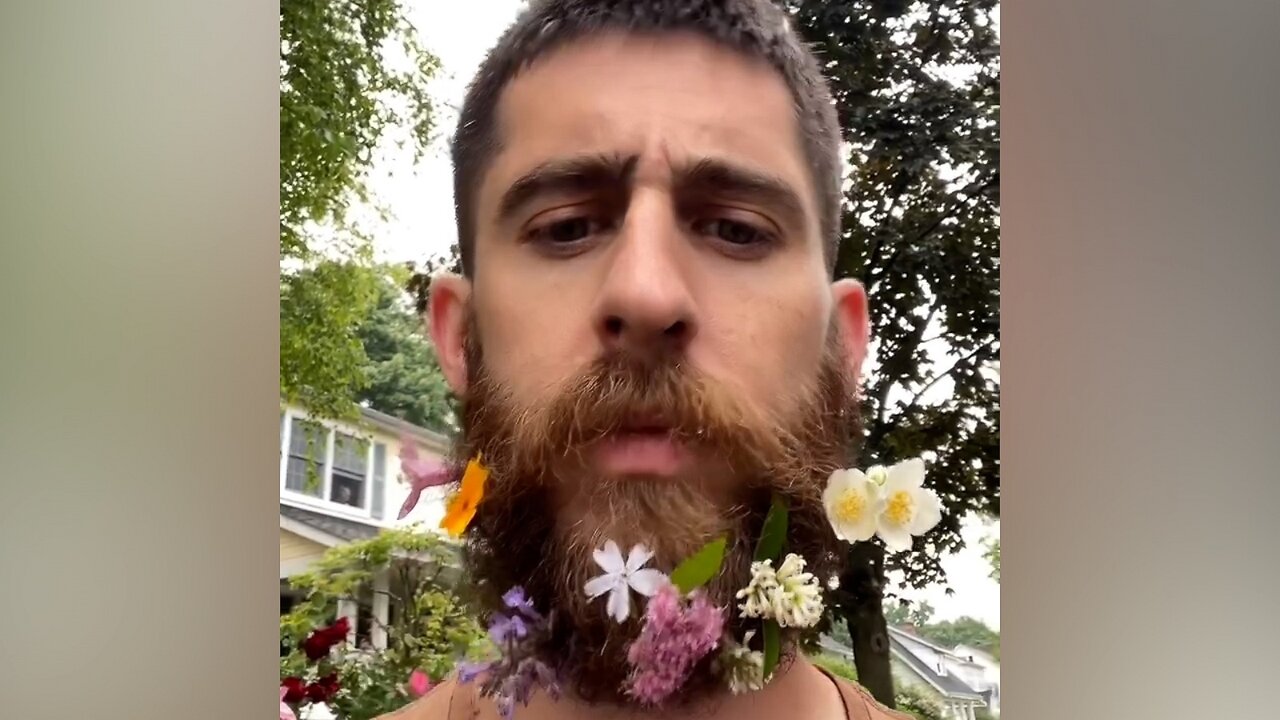 Dad puts flowers in beard for safekeeping during walk with daughter