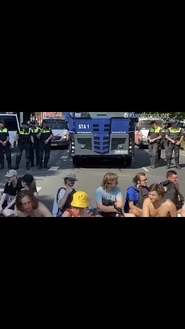 Police blasted a bunch Climate Change Activist away with a boat load of water! Must see! You