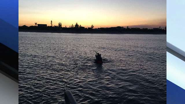 kydiver rescued by paddleboarder