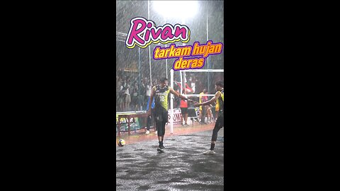 Professional player Rivan Nur Mulki plays in the rain