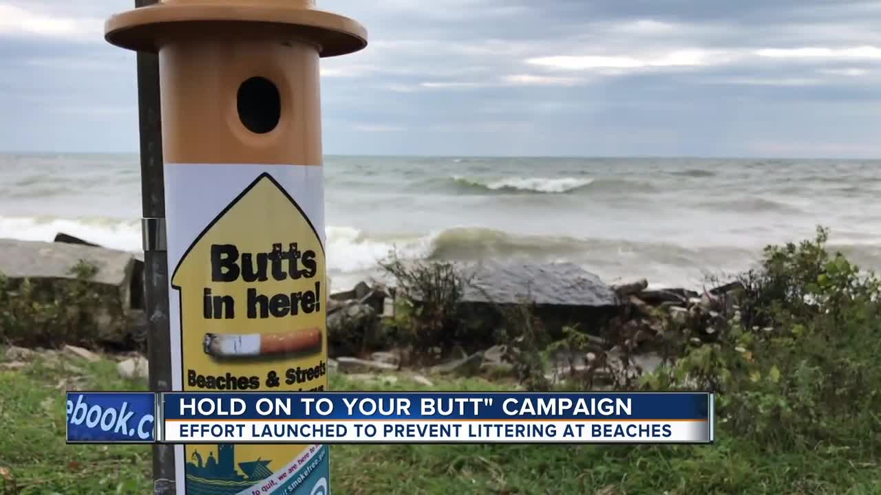Volunteers pick up cigarette butts along Lake Michigan
