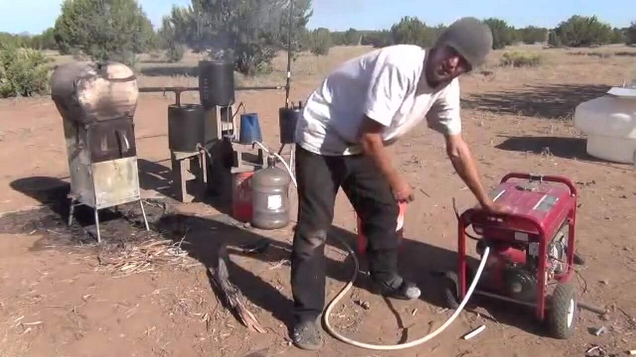 wood stove runs a generator, produces gasoline, runs a fridge and heats hot water at the same time