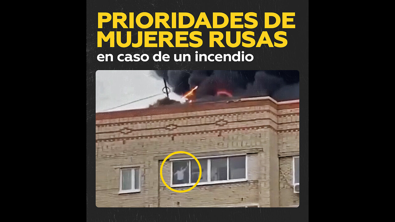 Limpieza ante todo: mujer rusa lava ventanas mientras un incendio arrasa tejado de su edificio