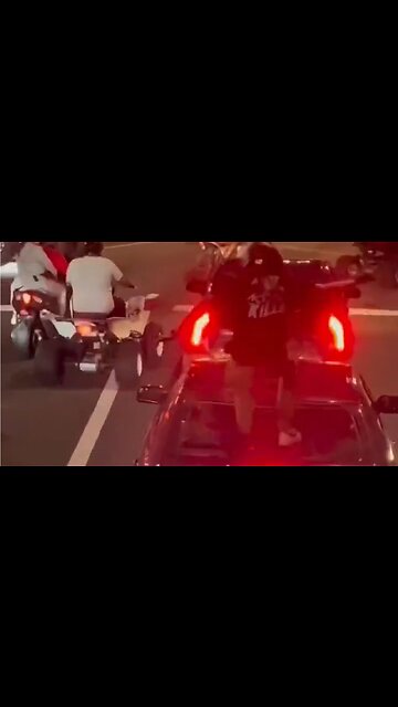 Punk Motorcyclist Jumps On Car And Smashes Rear Window With Child Inside In Philly