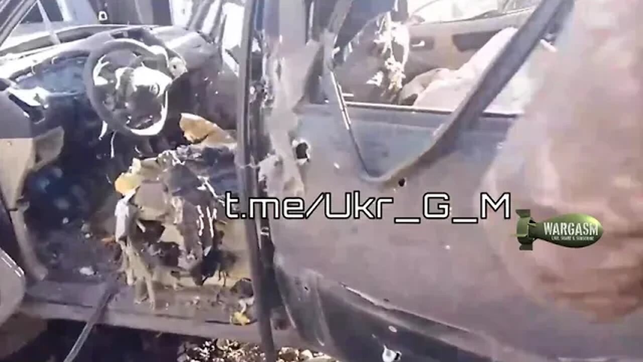 Ukrainian SUV after shell landed on it