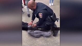 Brockton school officer kneels on student