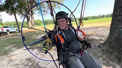 How does a paramotor pilot get into their seat?