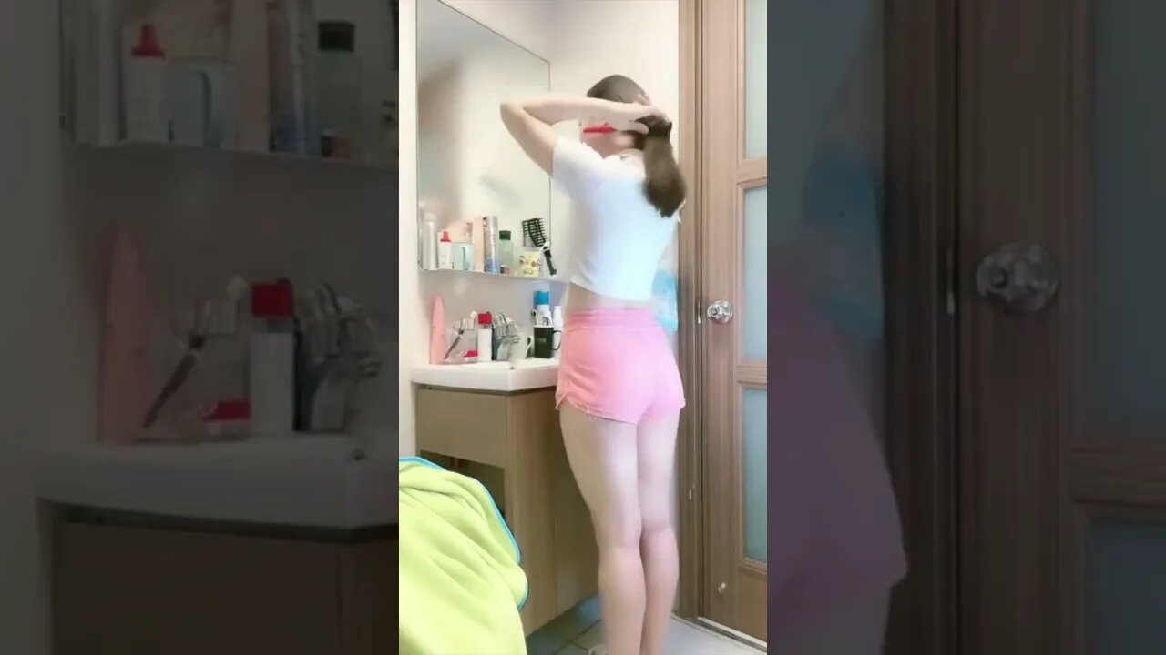 Chinese Girl Brushes Her Hair