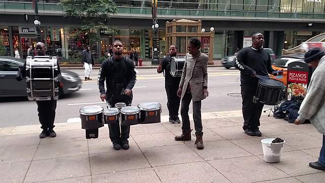 Amazing drumline gets help from surprise backup dancers