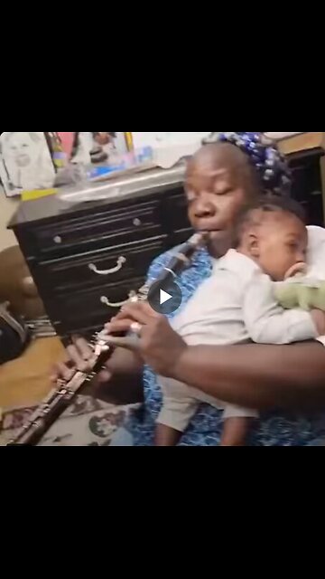 Clarinetist serenades her grandson with a jazz tune.