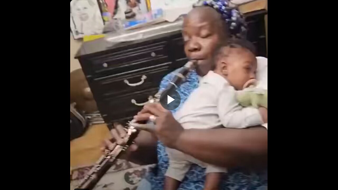 Clarinetist serenades her grandson with a jazz tune.