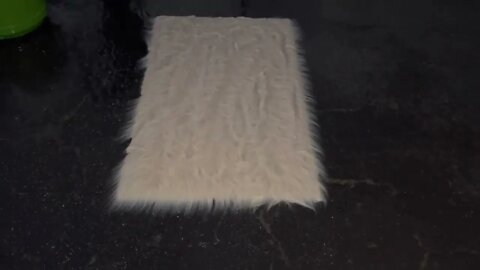 Oddly satisfying ASMR video of a fluffy white rug being washed. Carpet scraping, brushing, scrubbing