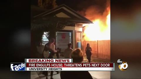 Fire engulfs house; threatens pets next door