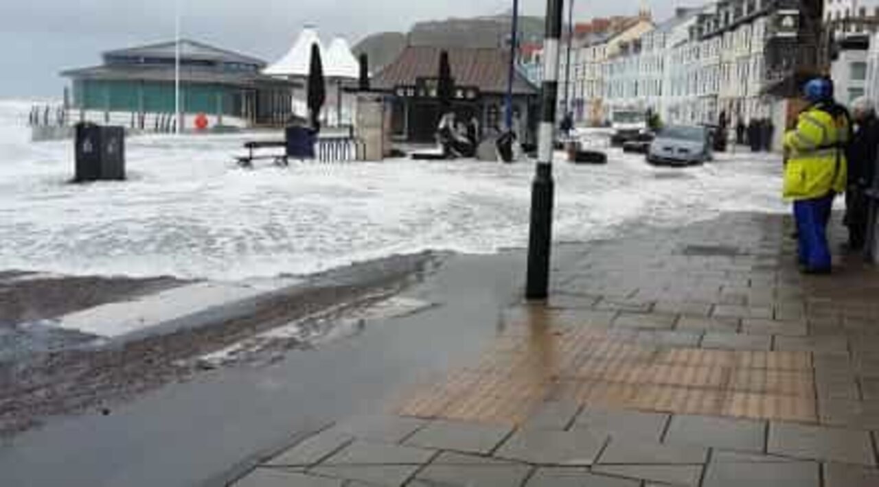 Storm Brian floods British streets