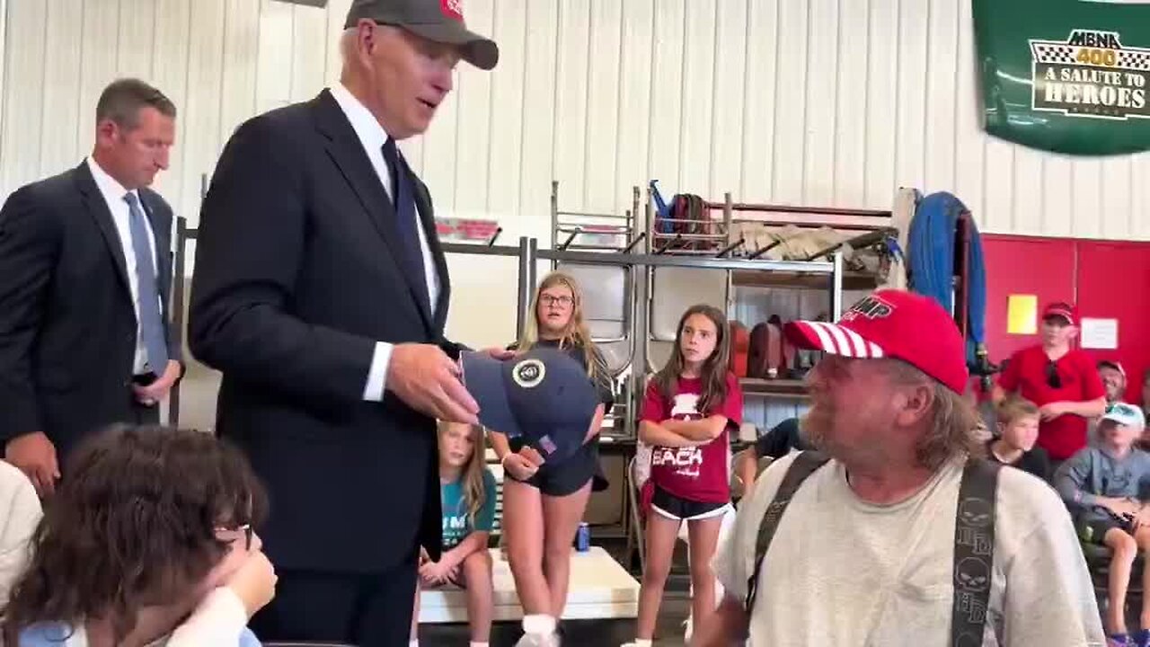 Biden Wears Trump Hat Then Says ‘No Eating Dogs and Cats’