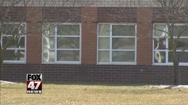 Teen arrested after Michigan school threat; guns found