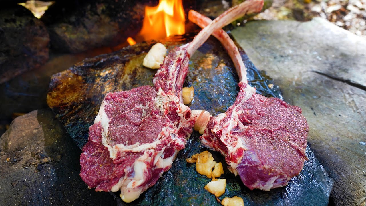 VERY JUICY AND DELICIOUS RIBEYE STEAK COOKED ON A ROCK | PERFECT TOMAHAWK STEAK IN THE WOODS