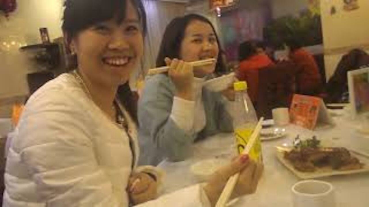 Eating a Bird's Head (Guangzhou, China)