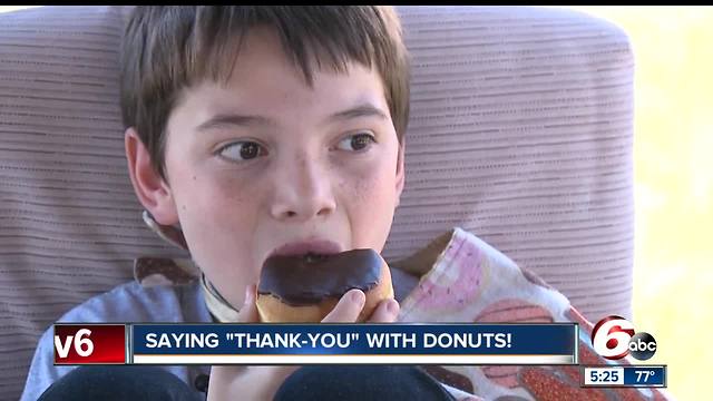 Young boy delivers donuts to police departments across the country