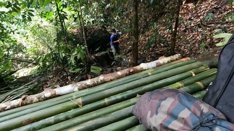 Building a bamboo shelter on a rock face:10