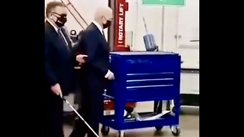 Joe Biden being lead around by a Blind Man