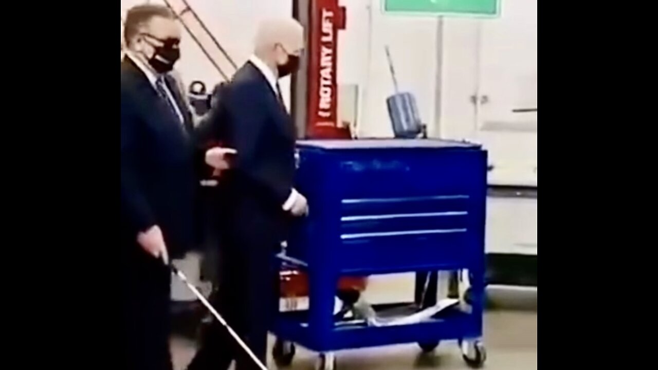 Joe Biden being lead around by a Blind Man