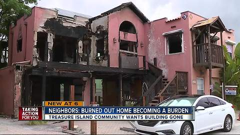 Burned-out home now burdening Treasure Island community