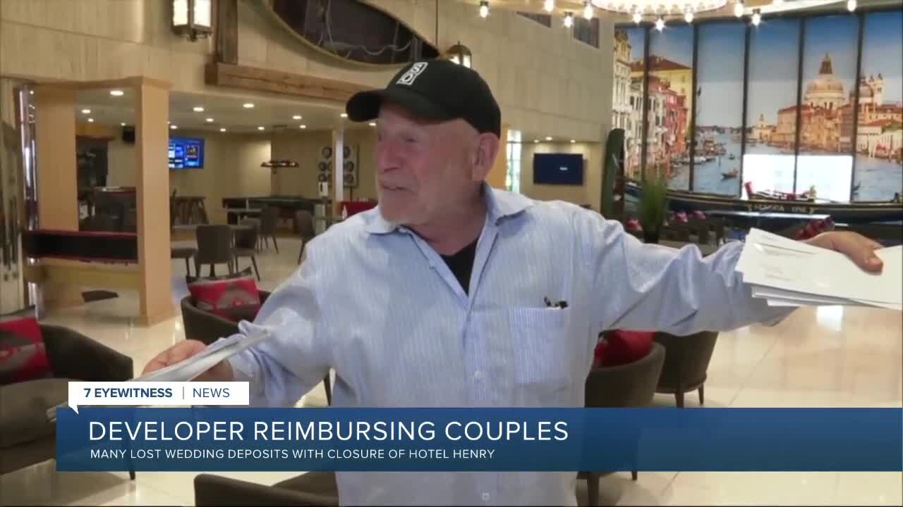 Buffalo developer Douglas Jemal gives reimbursement checks to couples who were supposed to be married at Hotel Henry