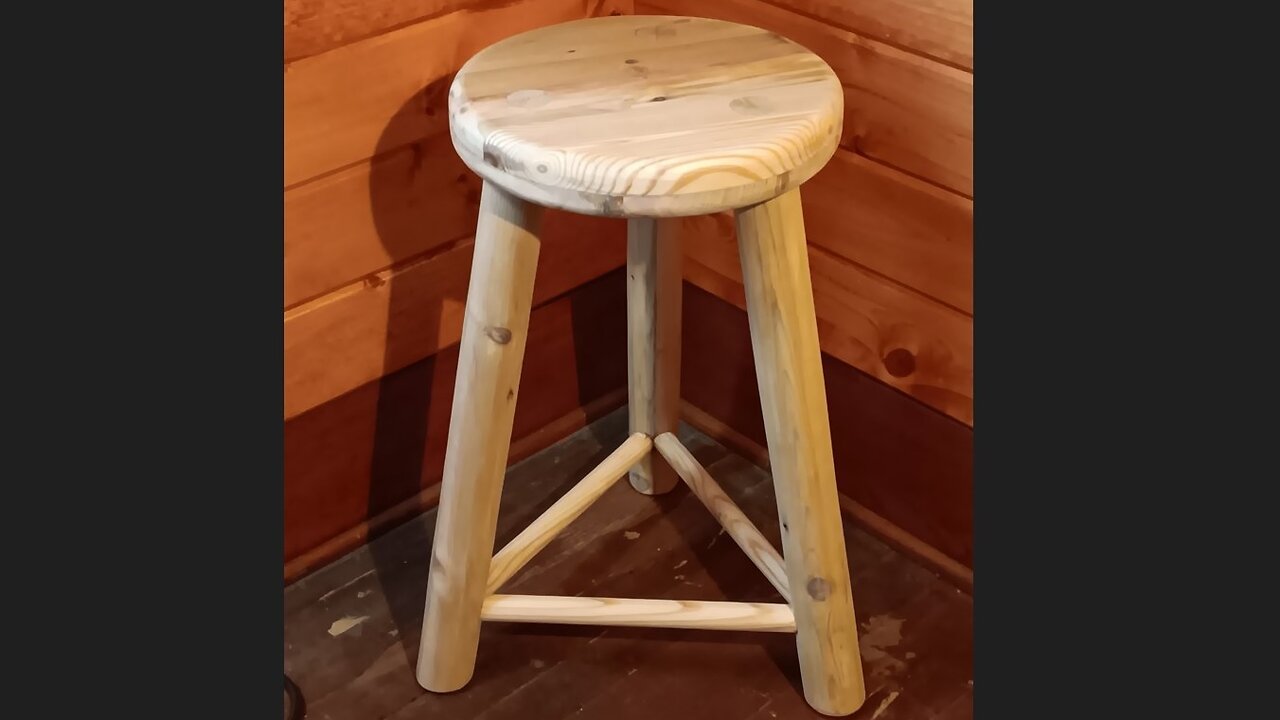 wooden stool with 3 legs made from old decking boards