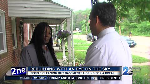 As people in Southwest Baltimore rebuild their keeping a fearful eye on the sky