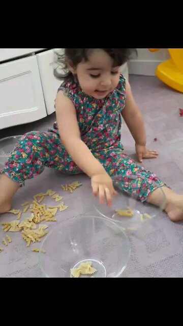 Our baby play with pasta