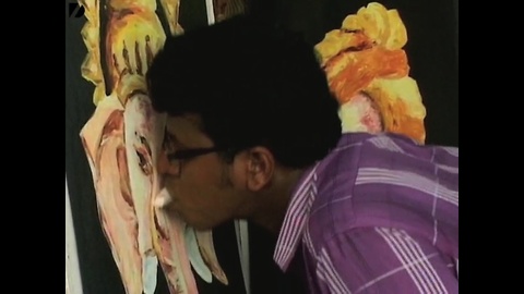 Guy Paints With Tongue
