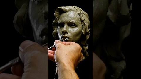 Sculpting A Portrait In Clay.