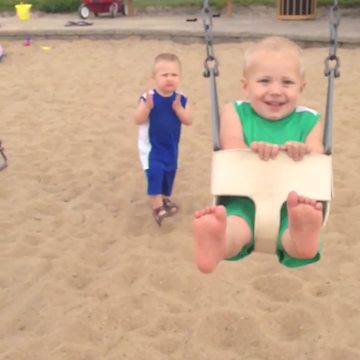 Tot Kid on Swings Knocks His Brother Over