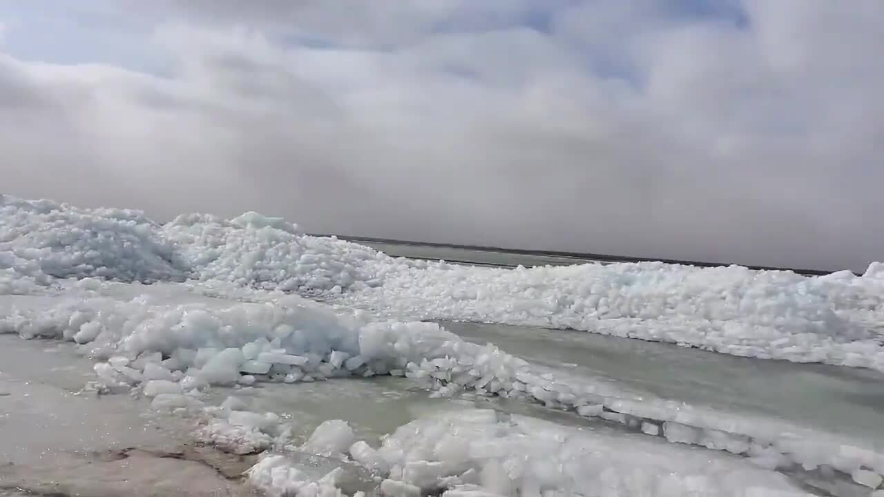 Strong winds cause massive ice pileups on Minnesota lake