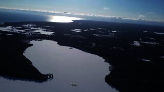 Small Lake ICED OVER, but Large FRESHWATER SEA Still Clear Blue!