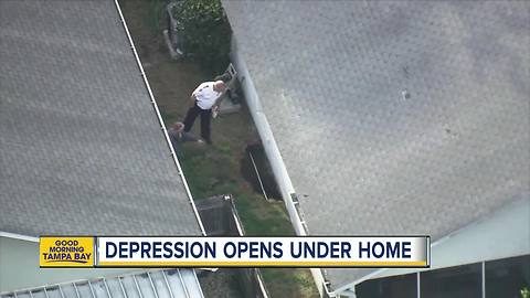 Large depression threatens homes in New Port Richey