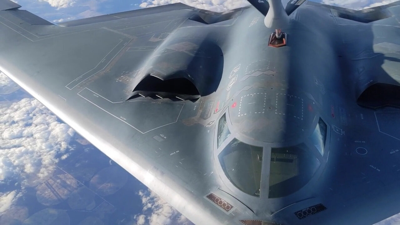 KC-135 Refuels B-2 Aircraft BROLL