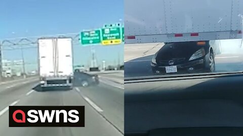 Bizarre footage shows truck dragging car pinned underneath it down Illinois motorway