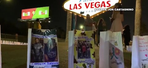 300 Light of Hope bags placed around the Las Vegas sign